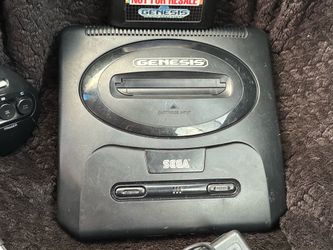 Sega console with controller and sonic the hedgehog