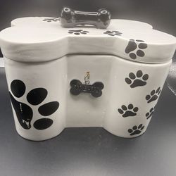 Bone-shaped ceramic dog treat jar with paw prints and 'Treats' tag