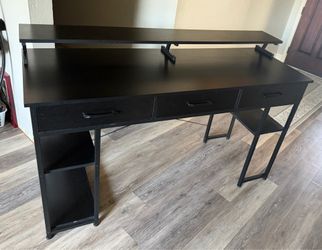 Black desk with monitor stand and drawers