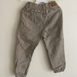 This is a Levi's brand boys' casual cuffed pants. • Brand: Levi's (Lewies) • Origin: Made in Kenya • Material: 100% cotton, the fabric looks like a ri