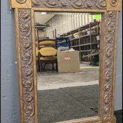 Gold framed rectangular mirror; measures 35”x25”