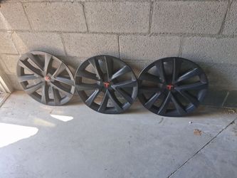 3 Tesla pre-owned hubcaps