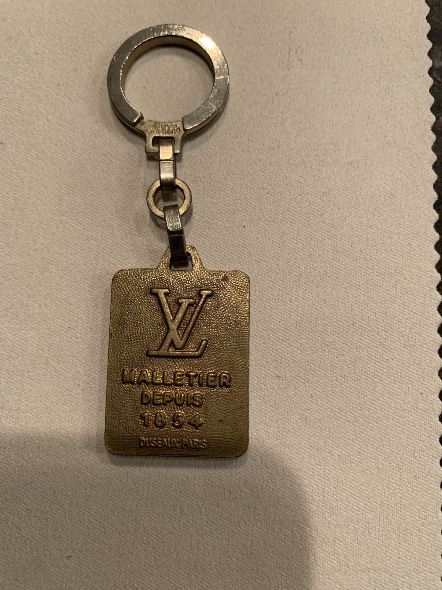 Vintage Louis Vuitton keychain from 1986