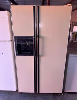 Beige GE Refrigerator And Freezer