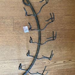 Dark grey metal wall wine rack