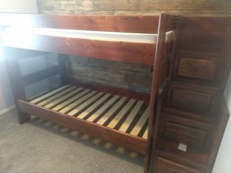 Living Spaces twin bunk beds with stairs and matching bookshelf