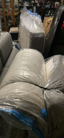 Rolled Mattress or Cushion Wrapped in Plastic