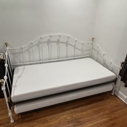 Metal framed twin day bed with extension to kind size