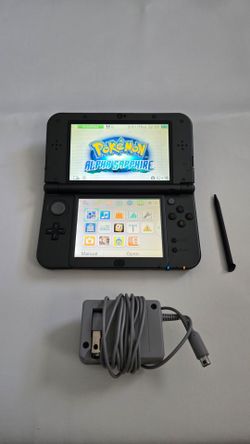 New Nintendo 3ds XL (dark grey/black) + Pokemon Alpha Sapphire + Monster Hunter Generations