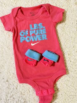 Pink Nike onesie with nike footies