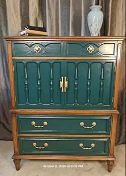 Solid wood  chest dresser with 4 drawers, shelves & 2 doors cabinet in good condition. All drawers have gold hardware and are working well. This versa