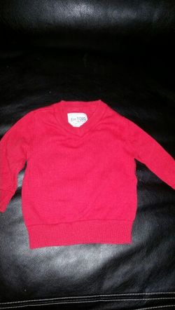 Children place sweater