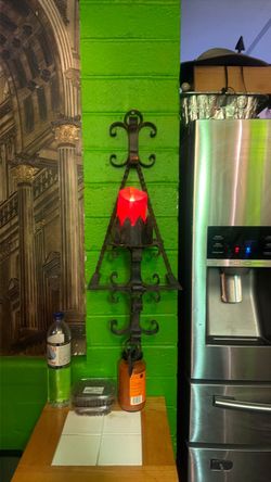 Mid Century Gothic style solid metal wall candle holder