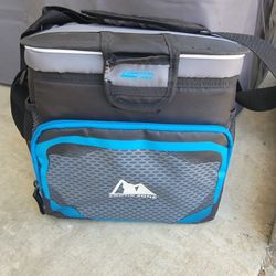Arctic Zone personal Cooler with front & side pockets & shoulder strap.