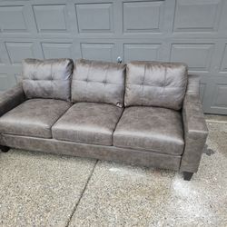Dark Gray Leather Couch and a chair 
