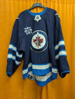 Connor Hellebuyck Game Worn Jersey