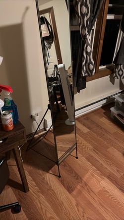 Grey metal stand mirror