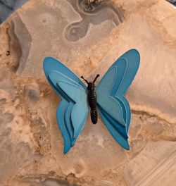 Multi layered blue metal butterfly brooch