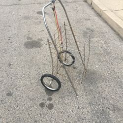 A GROCERY SHOPPING CART /LAUNDRY CART WITH TWO BUNGEE CORDS LITE WEIGHT AND STURDY FOLDS FLAT USED IN GOOD CONDITION $20.00