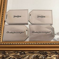 4.  Neiman. Marcus. Silver Tags