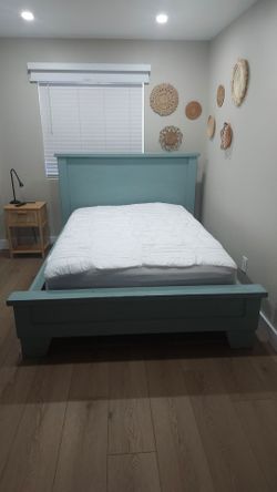 Full/queen bed frame, excluding mattress.