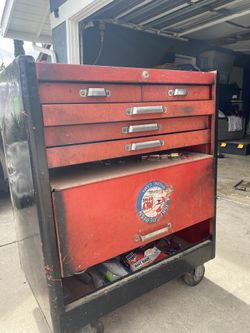 Tool box with tools inside must go.