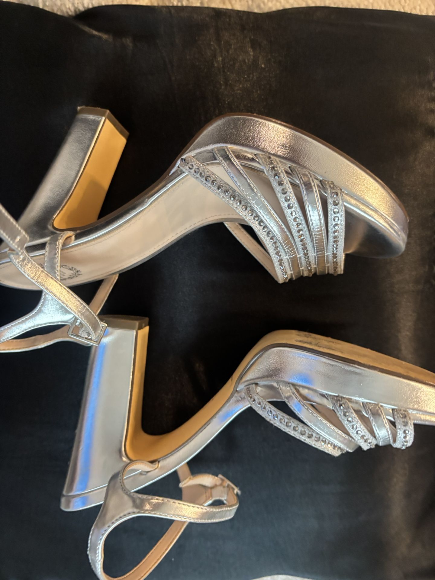 I.Miller beautiful shoes they are sparkly silver, size 8 1/2, they have rhinestones on them. They’re very beautiful.