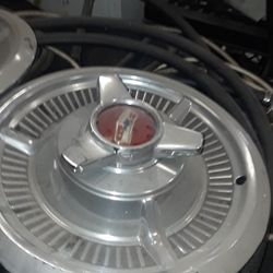 Two 58 Chevy Spinner Hub Caps