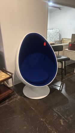 Blue and white egg swivel chair