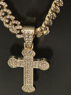 Gold plated. Tarnish free none fade Cross zircon necklace. You can wear it on two side 24 inches 