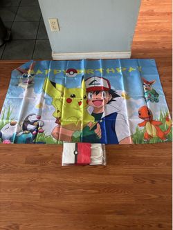 Pokémon birthday banner with party favor bags