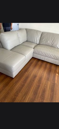 Light gray leather sectional used