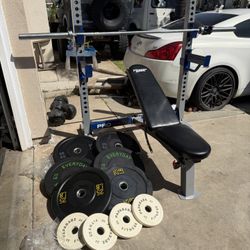 Bench press/squat rack with 7ft 45lbs bar and 228lbs of rubber plates