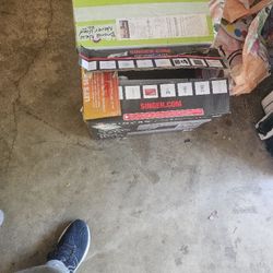 Two Sewing Machines One Used, One Brand New 