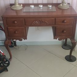 Elegant wooden desk vanity  table with two decorative lamps.