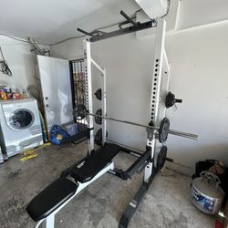 Squat rack/ Bench/ 300Lb Weights + Bar