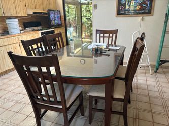 WOOD BROWN DINNING TABLE & 6 CHAIRS- W/GLASS TOP FOR PROTECTION