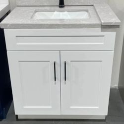 24-inch white Shaker vanity — solid wood cabinet with marble countertop. Special price.