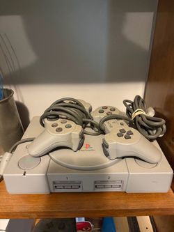 Refurbished PS1 with 2 controllers and 2 games