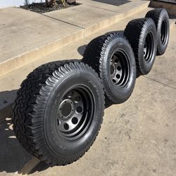 15" American Racing Baja style w- 32x11.50R15 BfGoodrich T/A KO tires. $150