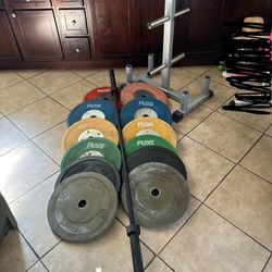 Olympic bumper competition weights 370lbs total plus 7ft bar and weights tree