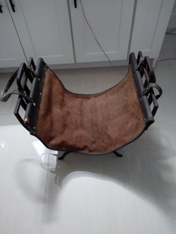 Wrought iron log holder with leather log carrier
