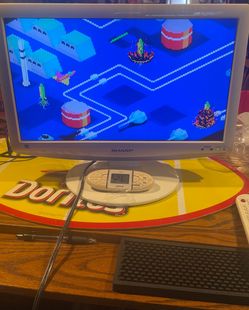 Small white tv with remote