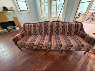Free vintage couch. Solid frame. Could use reupholstered