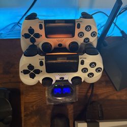 PS4 controllers, brand new, 20 each or 50 for a pair with charging base