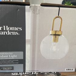 Globe clear glass pendant is made up with metal parts,