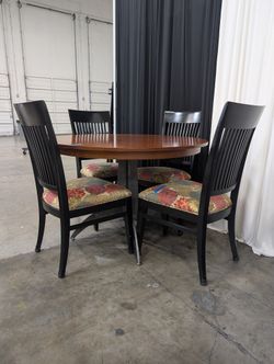 Round Wood Dining Table with Four Ethan Allen Black Chairs