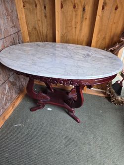OVAL MARBLE TOP TABLE