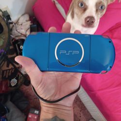 BLUE PSP WITH GAMES CHARGERS AND CASE