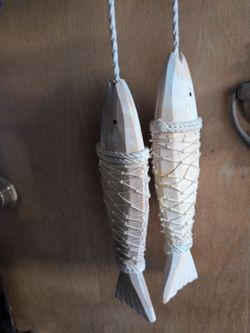 hand-carved wooden fish sculptures